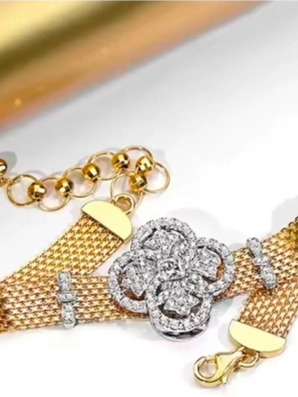 Gold Mesh Bracelet with Crystal Floral Emblem